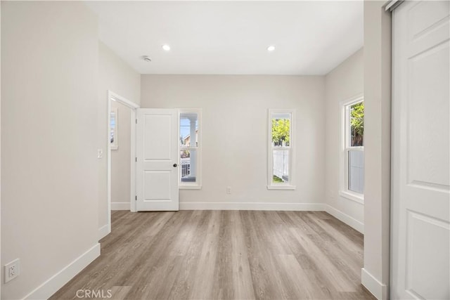 unfurnished room featuring light hardwood / wood-style floors