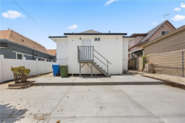 back of house with a patio