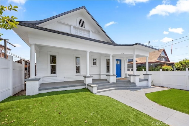 view of front of house with a front lawn and a porch