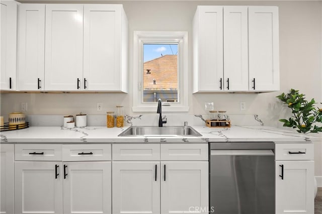 kitchen featuring sink, white cabinets, and dishwasher