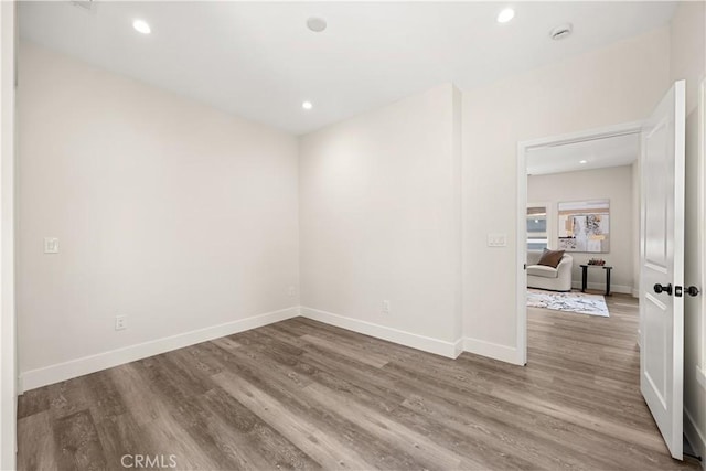 unfurnished room featuring hardwood / wood-style floors