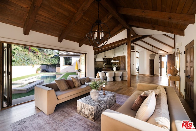 living room with hardwood / wood-style flooring, wood ceiling, beamed ceiling, and a chandelier