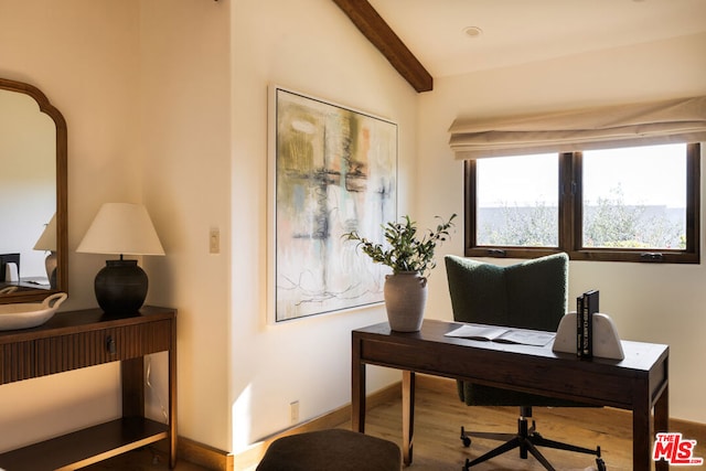 home office featuring hardwood / wood-style floors and lofted ceiling with beams