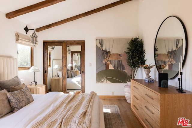 bedroom featuring lofted ceiling with beams and dark hardwood / wood-style floors