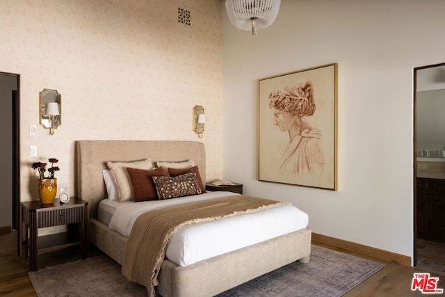 bedroom featuring dark hardwood / wood-style flooring