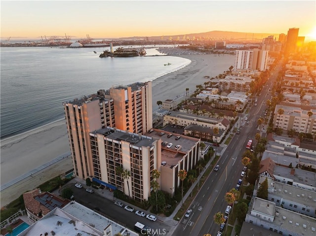 aerial view at dusk with a water view