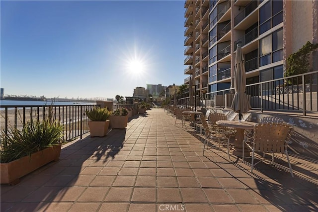 view of patio with a water view