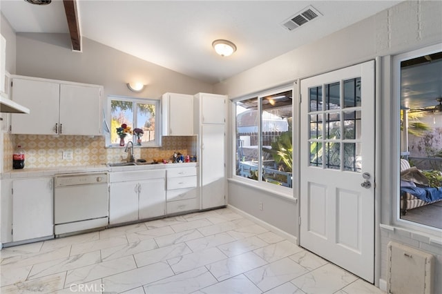 kitchen with vaulted ceiling with beams, white cabinets, white dishwasher, and decorative backsplash