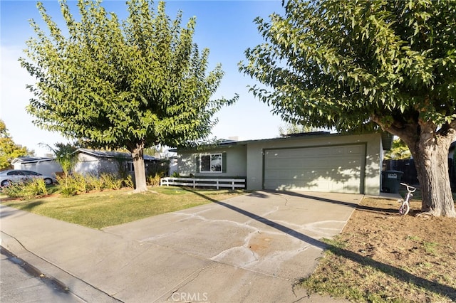 view of front of home with a garage and a front yard