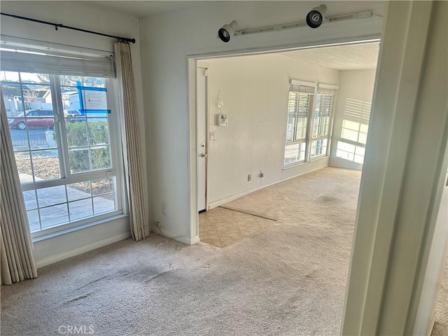 401 Fenmore Dr, Barstow, CA 92311 - foyer entrance featuring carpet floors and plenty of natural light