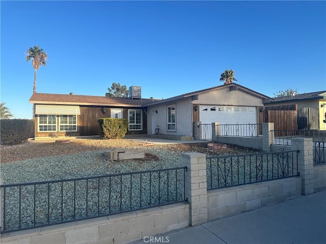 ranch-style home featuring a garage and central AC unit