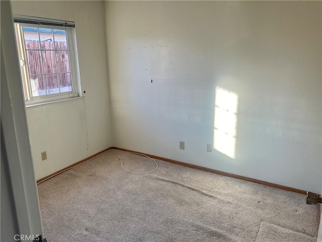 empty room with carpet flooring