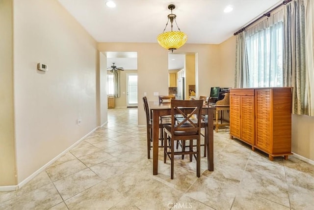 dining room featuring light tile patterned floors and ceiling fan