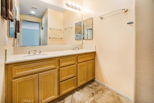 bathroom featuring tile patterned floors and vanity