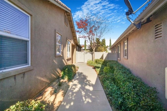 view of side of property with a patio