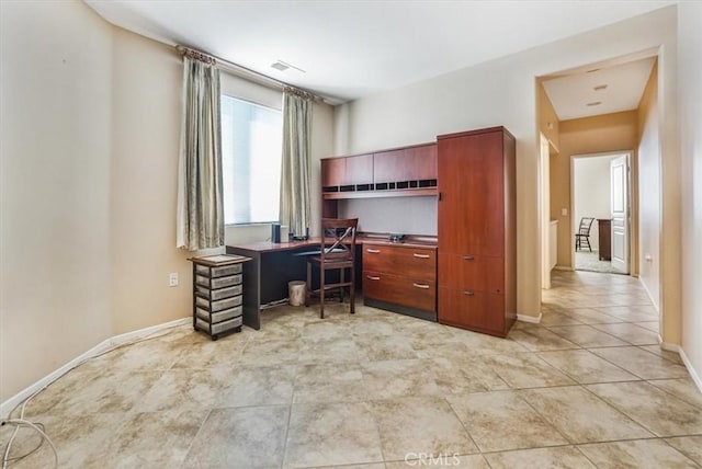 office area with light tile patterned floors