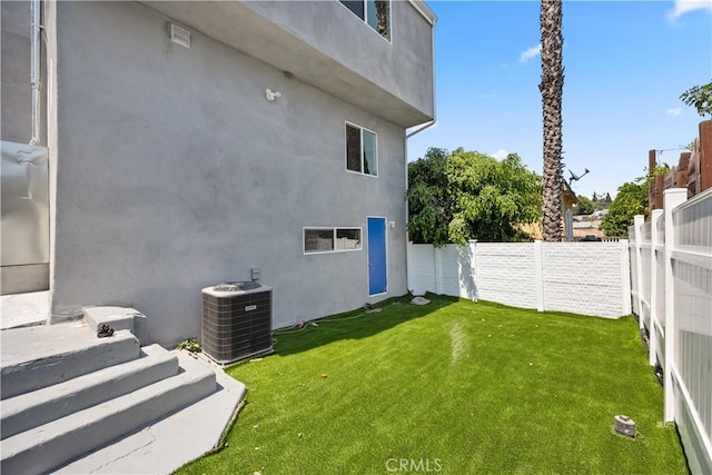 view of yard featuring central AC