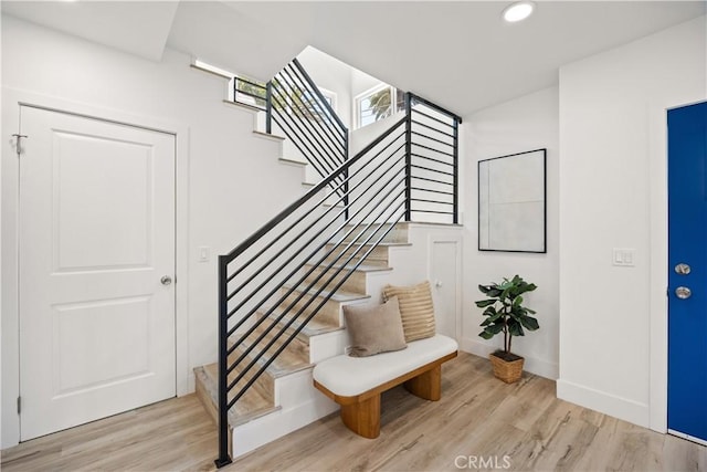 stairway featuring hardwood / wood-style floors