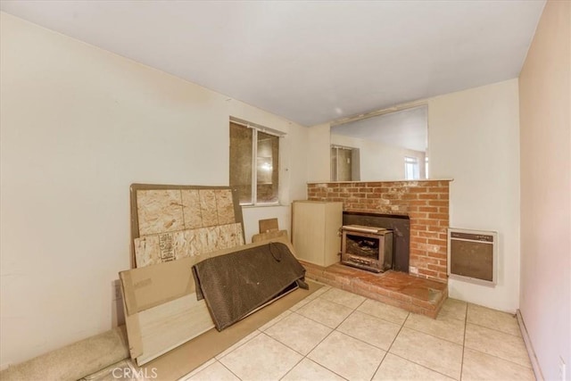 living area with heating unit and light tile patterned floors