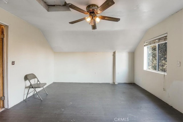 bonus room with ceiling fan, dark hardwood / wood-style flooring, and lofted ceiling