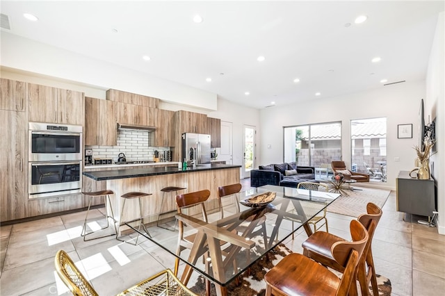 dining area featuring light tile patterned floors