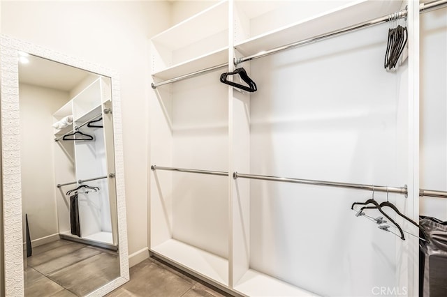 spacious closet featuring tile patterned floors