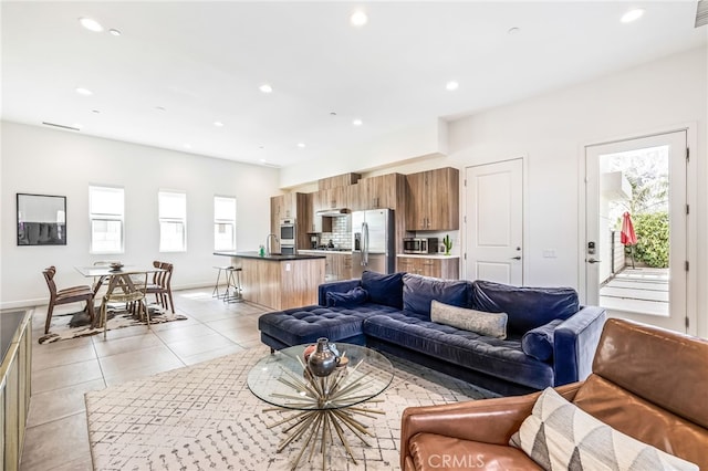 living room featuring light tile patterned floors