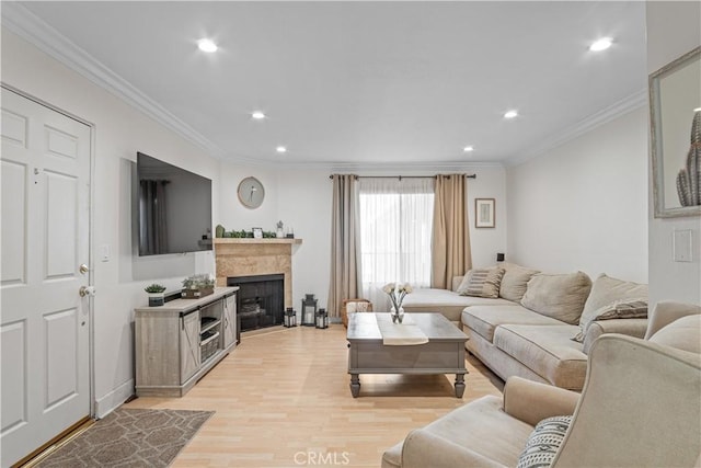 living room featuring light hardwood / wood-style floors and ornamental molding