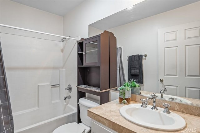 full bathroom featuring vanity,  shower combination, and toilet