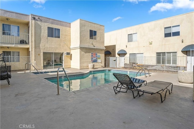 view of swimming pool with a patio area