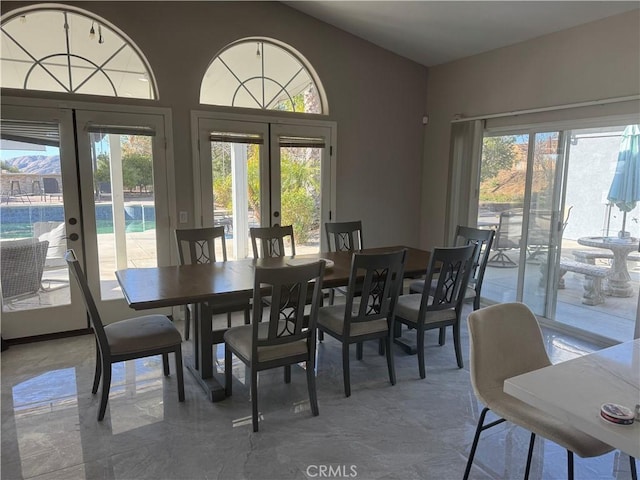 dining space with french doors and plenty of natural light