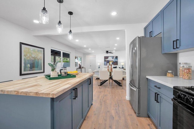 kitchen with ceiling fan, electric range, decorative light fixtures, light hardwood / wood-style flooring, and butcher block counters