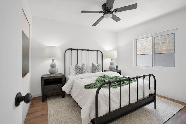 bedroom featuring hardwood / wood-style flooring and ceiling fan