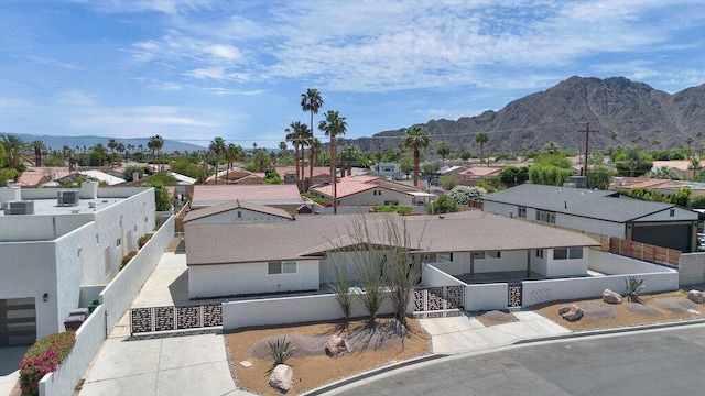 birds eye view of property featuring a mountain view