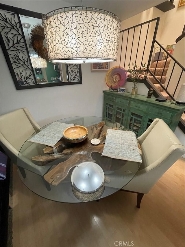 dining space featuring wood-type flooring