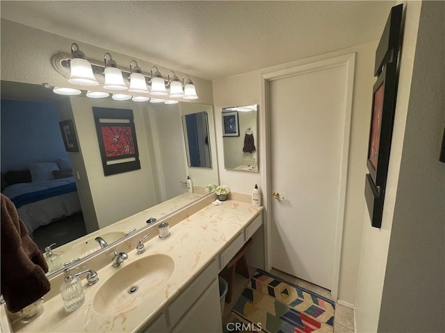 18223 Soledad Canyon Rd Unit 29, Canyon Country, CA 91387 - bathroom with ensuite bath, vanity, and a textured ceiling
