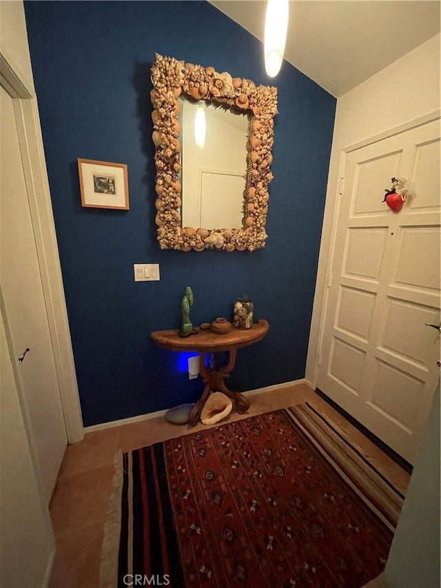 18223 Soledad Canyon Rd Unit 29, Canyon Country, CA 91387 - foyer entrance featuring tile patterned flooring, baseboards, and lofted ceiling