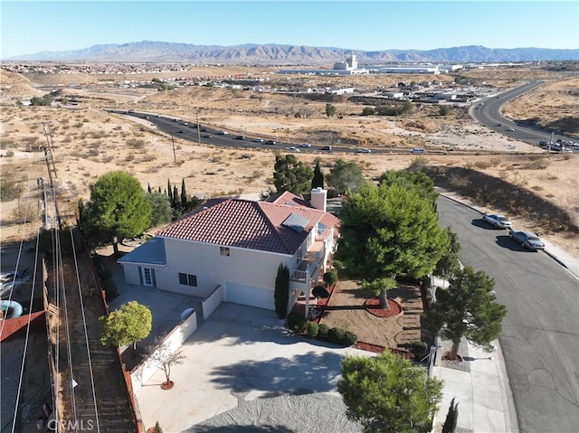 birds eye view of property featuring a mountain view