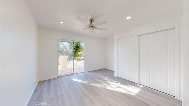 unfurnished bedroom with ceiling fan, light hardwood / wood-style flooring, access to outside, and a closet