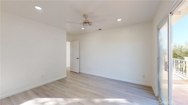 unfurnished room with light wood-type flooring and ceiling fan