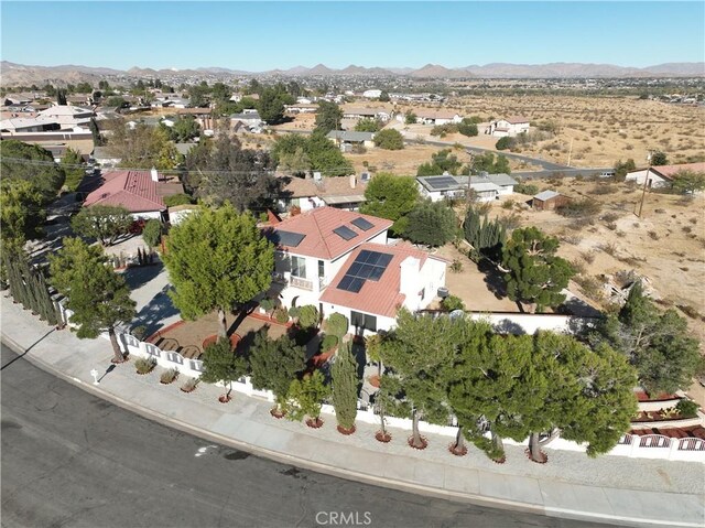 birds eye view of property featuring a mountain view