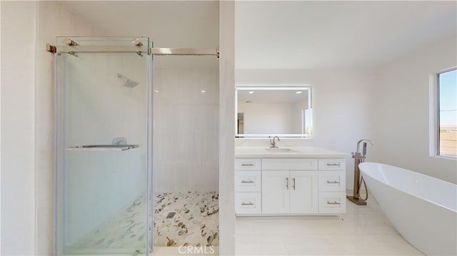 bathroom featuring vanity and shower with separate bathtub