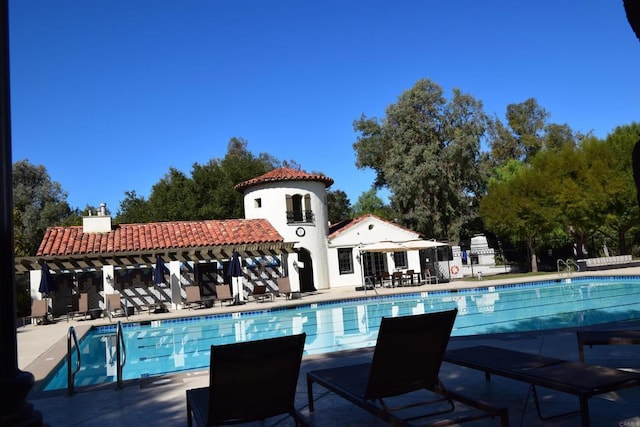 view of pool featuring a patio area