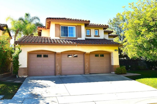 mediterranean / spanish-style home featuring a garage