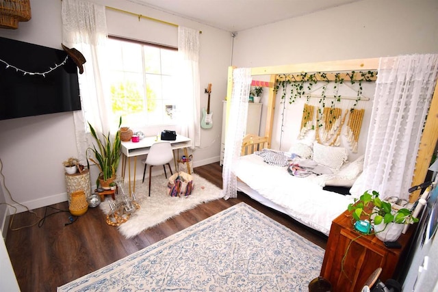 bedroom with wood-type flooring