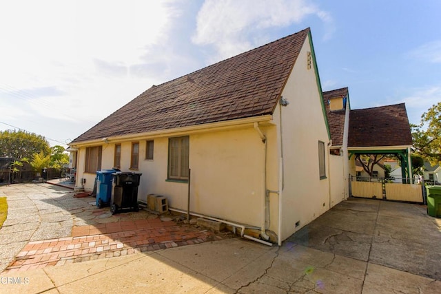 view of side of property featuring a patio area