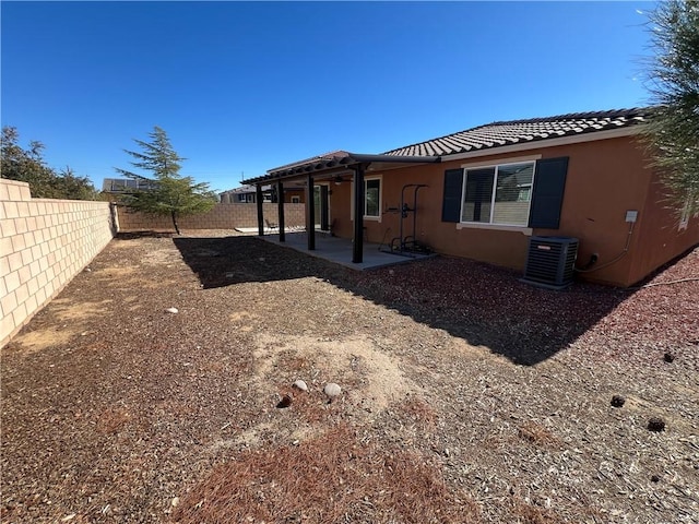 back of house with a patio and central AC unit