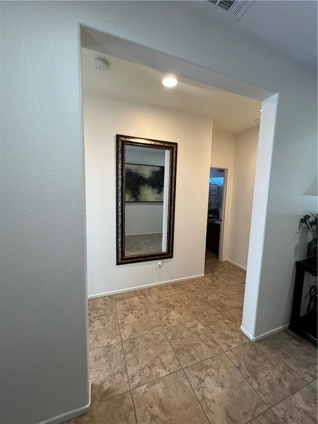 hallway with light tile patterned floors