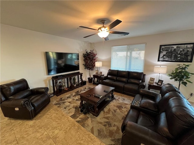 tiled living room with ceiling fan