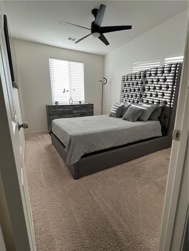 carpeted bedroom with ceiling fan